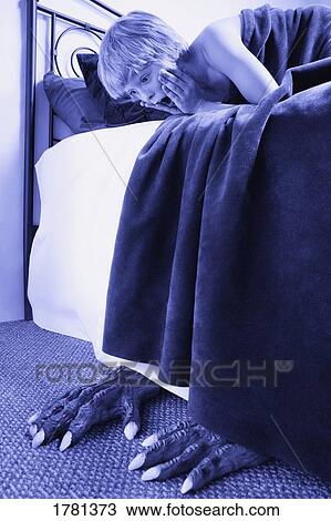 Stock Image - Monster under my bed. Fotosearch