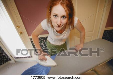 Woman ironing View Large Photo Image Stock Photography - Woman ironing. Fotosearch