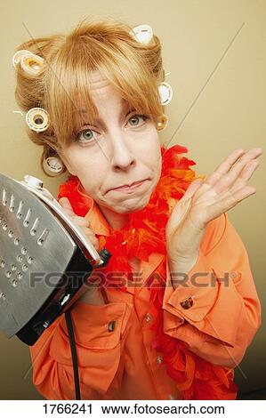 Stock Image - Woman with an iron. Fotosearch