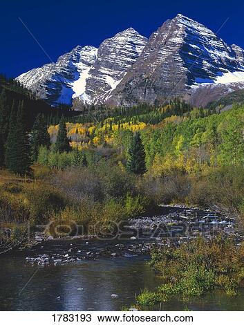 Stock Image - View of Maroon Bells peaks and Maroon Creek. Fotosearch