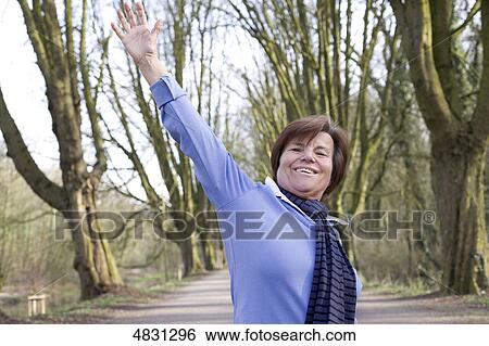 Active senior woman doing work out View Large Photo Image Stock Photograph - Active senior woman doing work out . Fotosearch