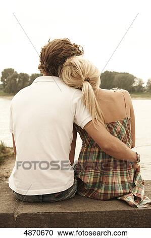 Stock Image - Affectionate young couple outdoors . Fotosearch