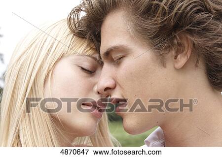 Stock Photo - Affectionate young couple outdoors . Fotosearch