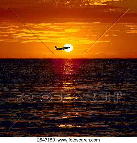 Airplane flying over sea View Large Photo Image Stock Image - Airplane flying over sea . Fotosearch