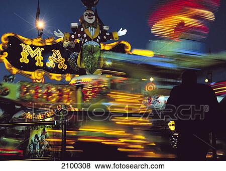Amusement park lit up at night, Munich Beer Festival, Munich, Bavaria, Germany View Large Photo Image Stock Photo - Amusement park lit up at night, Munich Beer Festival, Munich, Bavaria, Germany . Fotosearch