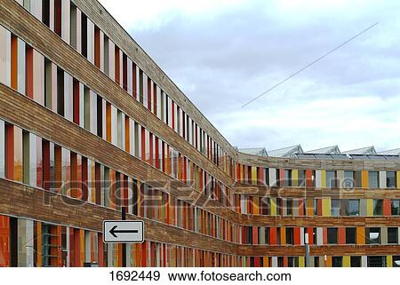 Stock Photo - Arrow sign in front of building . Fotosearch