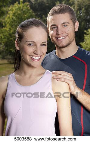 Athletic young couple outdoors, portrait View Large Photo Image Stock Photo - Athletic young couple outdoors, portrait . Fotosearch
