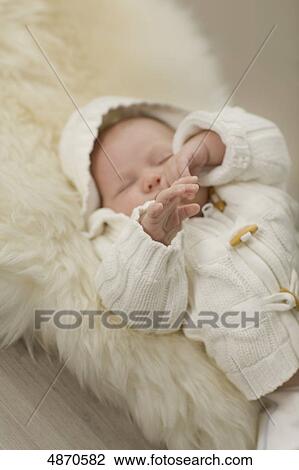 Baby lying on fur View Large Photo Image Stock Image - Baby lying on fur . Fotosearch