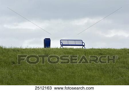 Bench and dustbin in park View Large Photo Image Stock Image - Bench and dustbin in park . Fotosearch