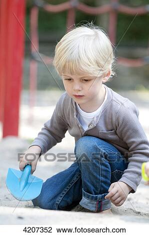Blond boy playing on playground View Large Photo Image Stock Image - Blond boy playing on playground . Fotosearch