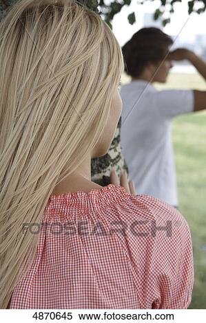 Stock Photography - Blond woman and man outdoors . Fotosearch