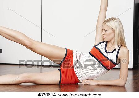 Blond young woman exercising View Large Photo Image Picture - Blond young woman exercising . Fotosearch