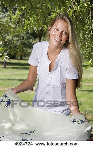 Picture - Blond young woman outdoors . Fotosearch
