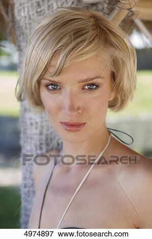 Stock Photo - Blond young woman outdoors, portrait . Fotosearch