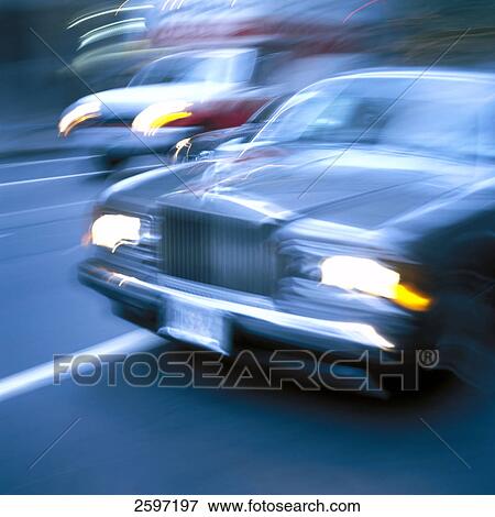Stock Photo - Blurred view of cars on road . Fotosearch