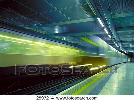 Blurred view of train leaving station View Large Photo Image Picture - Blurred view of train leaving station . Fotosearch