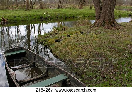 Stock Photo - Boat in stream . Fotosearch