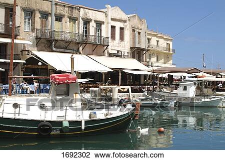 Stock Image - Boats at harbor . Fotosearch