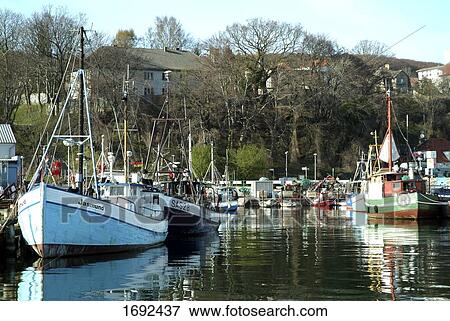 Stock Photo - Boats at harbor . Fotosearch
