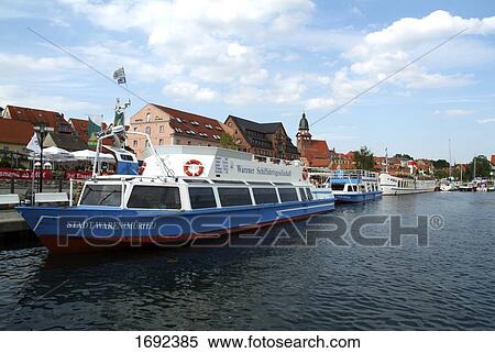 Stock Photography - Boats at harbor . Fotosearch