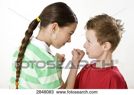 Stock Image - Boy and his sister rough housing . Fotosearch