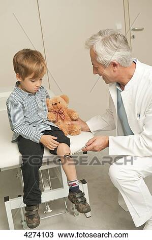 Stock Image - Boy at the doctor . Fotosearch