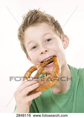 Boy having bread View Large Photo Image Stock Photograph - Boy having bread . Fotosearch