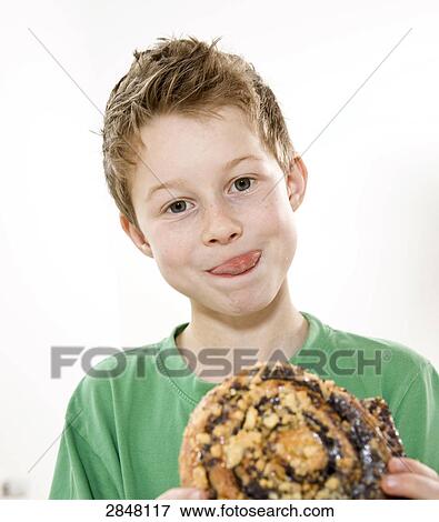 Boy having pizza View Large Photo Image Stock Photo - Boy having pizza . Fotosearch