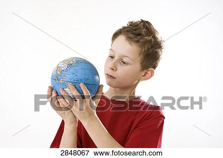 Boy holding globe View Large Photo Image Stock Photo - Boy holding globe . Fotosearch