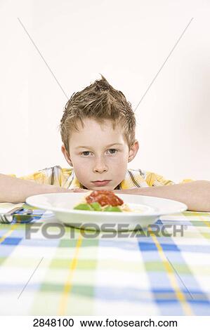 Boy looking at food View Large Photo Image Stock Image - Boy looking at food . Fotosearch