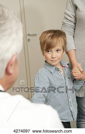 Boy with mother at the doctor View Large Photo Image Stock Photo - Boy with mother at the doctor . Fotosearch