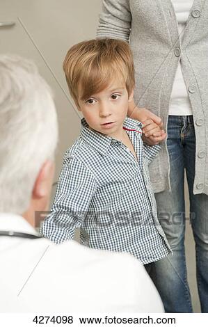 Boy with mother at the doctor View Large Photo Image Stock Photo - Boy with mother at the doctor . Fotosearch