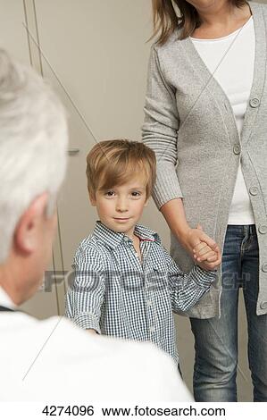 Boy with mother at the doctor View Large Photo Image Stock Photograph - Boy with mother at the doctor . Fotosearch