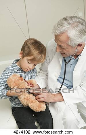 Boy with teddy at the doctor View Large Photo Image Stock Image - Boy with teddy at the doctor . Fotosearch