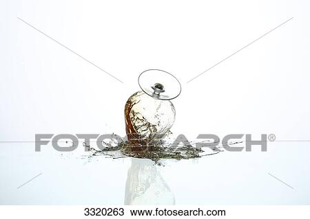 Brandy splashing out of glass View Large Photo Image Stock Image - Brandy splashing out of glass . Fotosearch