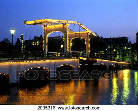 Bridge lit up at night View Large Photo Image Stock Photograph - Bridge lit up at night . Fotosearch