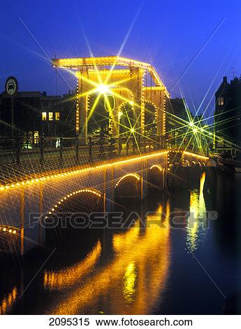 Bridge lit up at night View Large Photo Image Stock Photography - Bridge lit up at night . Fotosearch
