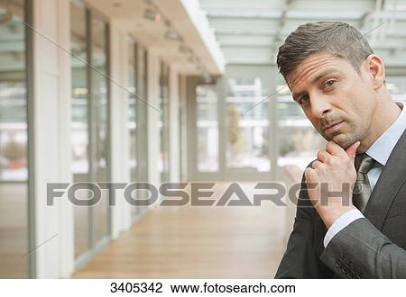 Stock Image - Business man looking at camera . Fotosearch