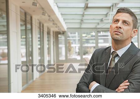 Stock Photograph - Business man looking up . Fotosearch