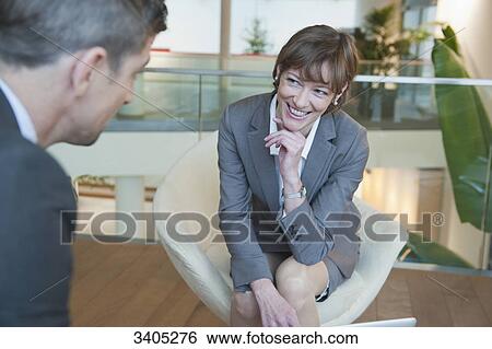 Business woman and business in a conversation View Large Photo Image Stock Photograph - Business woman and business in a conversation . Fotosearch