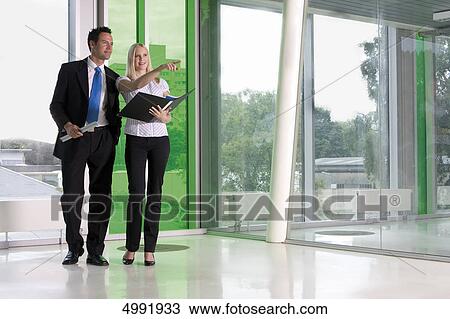 Businessman and woman talking View Large Photo Image Stock Image - Businessman and woman talking . Fotosearch