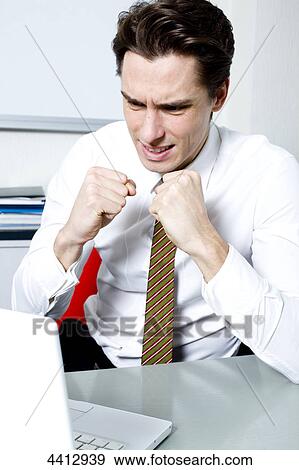 Businessman clenching his fist View Large Photo Image Stock Photo - Businessman clenching his fist . Fotosearch