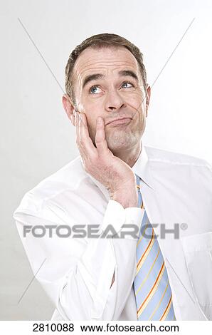 Stock Photo - Businessman day dreaming . Fotosearch