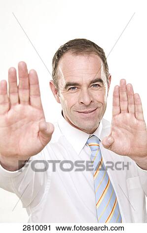 Businessman gesturing and smiling View Large Photo Image Stock Image - Businessman gesturing and smiling . Fotosearch
