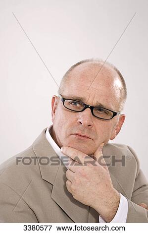 Businessman looking pensive, portrait View Large Photo Image Stock Photo - Businessman looking pensive, portrait . Fotosearch