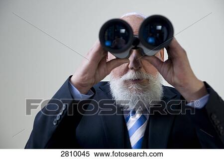 Businessman looking through binoculars View Large Photo Image Stock Photography - Businessman looking through binoculars . Fotosearch