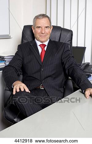 Stock Photo - Businessman sitting at Laptop . Fotosearch