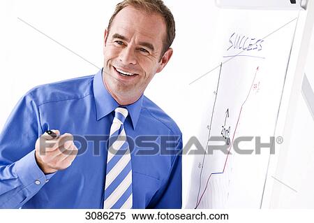 Businessman standing in front of a flip chart, close-up View Large Photo Image Stock Photography - Businessman standing in front of a flip chart, close-up . Fotosearch