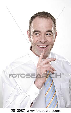 Businessman thinking and smiling View Large Photo Image Stock Photo - Businessman thinking and smiling . Fotosearch