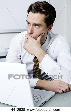 Stock Photo - Businessman thinking . Fotosearch
